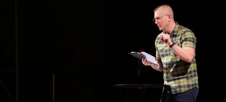Pastor Vernon Burger preaching